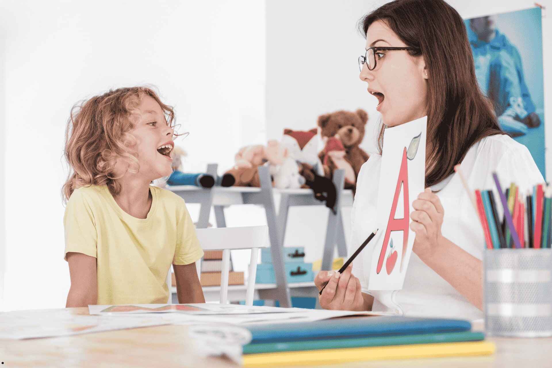 Speech Conditions We Treat - SLP with a Child doing Therapy